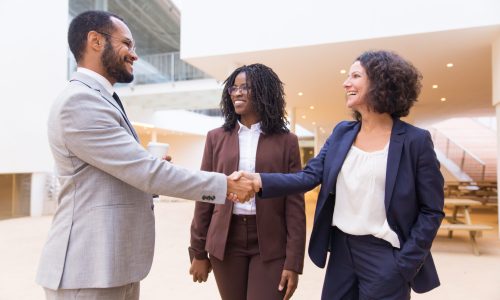 happy positive business partners finishing meeting