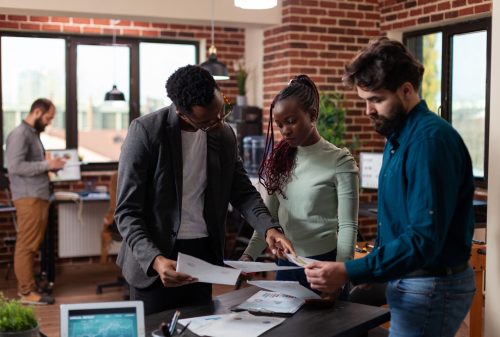 multi ethnic businesspeople discussing company collaboration